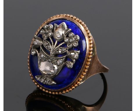 19th Century diamond and enamel ring, the head with a diamond set foliate urn on a blue enamel back, ring size P