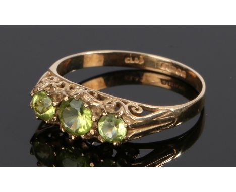 9 carat gold ring, set with three green stones to the head, ring size P