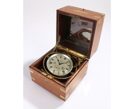 Waltham ships clock, the signed white dial with Roman numerals and subsidiary seconds dial, housed in a brass gimble and teak