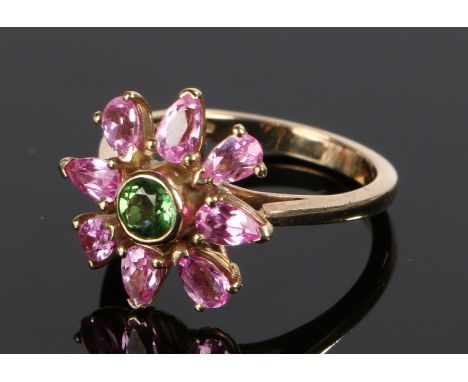 9 carat gold ring, the flower head design with a central green stone and pink stone surround, ring size P