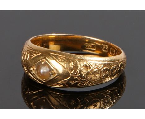 Victorian 18 carat gold pearl set ring, assayed for Birmingham 1881, the central pearl set with engraved tapering shoulders, 