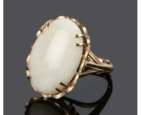 9 carat gold opal set ring, with a cabochon cut opal to the head, ring size O