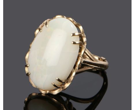 9 carat gold opal set ring, with a cabochon cut opal to the head, ring size O