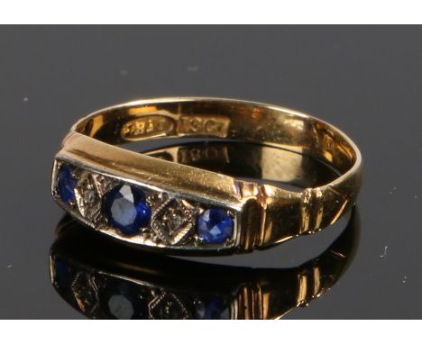 18 carat gold sapphire and diamond set ring, with three sapphires and two diamonds to the head, ring size N