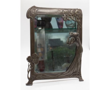 WMF - An early 20th century Art Nouveau "First Cuckoo" silver plated easel back mirror, having relief decoration of a lady an