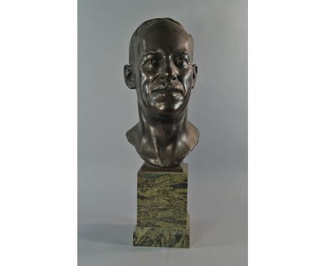 A bronze portrait bust of Sir Phillip Richardson, 20th century, mounted on a square green marble socle, signed to the back J 