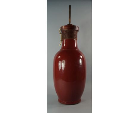 A Chinese sang de boeuf baluster vase, lacking top, converted to a lamp, 60cm high 