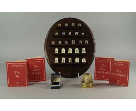 A silver thimble made to commemorate the Coronation of Queen Elizabeth II, together with nine other silver thimbles, variousl