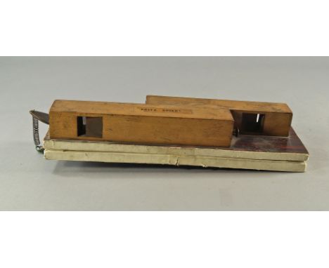 A box wood and metal whistle, possibly for imitating bird calls, labelled Fritz Spiegl 29.5cm wide (VAT charged on the hammer