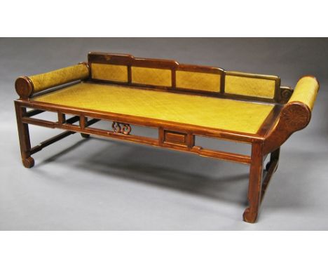 A Chinese carved hardwood day bed, 20th century, with scroll arms, reeded seat.  CONDITION REPORT: (H x W x D): 75 x 190 x 70