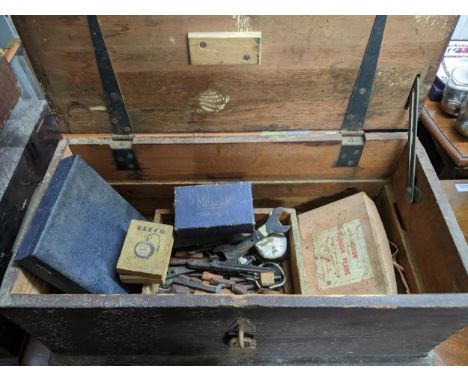 A mixed lot of tools contained mainly in three wooden tool boxes to include a Mercer dial gauge, a Mitor plough plane, chisel