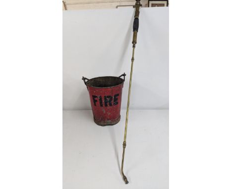 A vintage fire bucket, together with a brass eclipse sprayer lamp Location: 