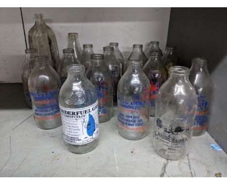 A group of vintage glass milk bottles, some from local dairies, to include Stokes Dairy Camberley and Marsh Dairies Stokenchu