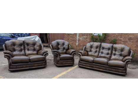 A Thomas Lloyd brown leather button back upholstered suite consisting of a three seater sofa, two seater sofa and an armchair