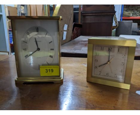 A Tiffany &amp; Co brass cased alarm clock, and a Garrard brass cased quartz mantel clock, both with presentation inscription