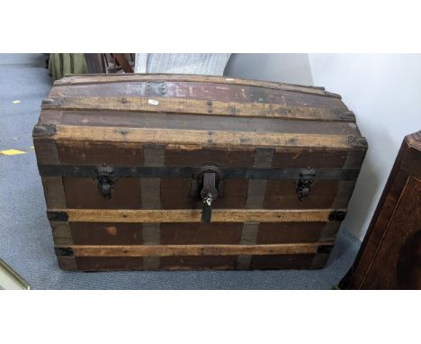 A Victorian domed top steamer trunk, canvas bound with wrought iron supports, 52cm h x 83cm wLocation: 