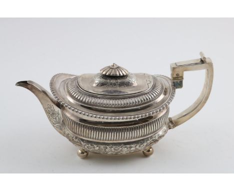 A GEORGE III TEAPOT. of rounded rectangular form, with later decoration (and later hallmarked handle),  inscribed on the base