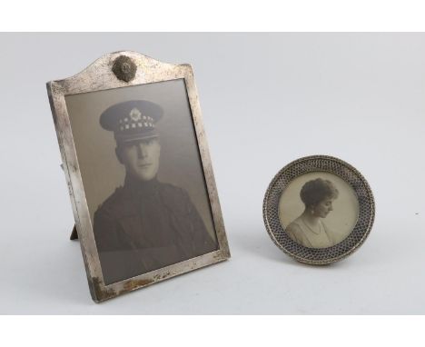 A GEORGE V MOUNTED WOODEN PHOTOGRAPH FRAME. with an applied Regimental badge of the Scots Guard and an easel back, maker's ma
