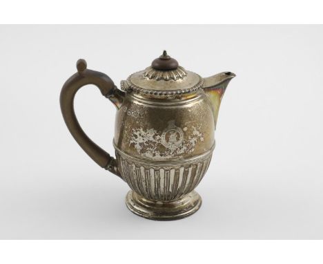 A LATE VICTORIAN HOT WATER POT. the domed cover with fluted decoration, turned finial and a gadrooned border, the lower body 