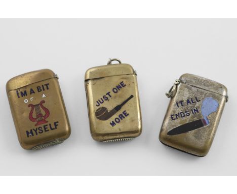 THREE LATE 19TH/EARLY 20TH CENTURY BRASS VESTA CASES. with enamel decoration "IT ALL ENDS IN SMOKE", "IM A BIT OF A LYRE MYSE