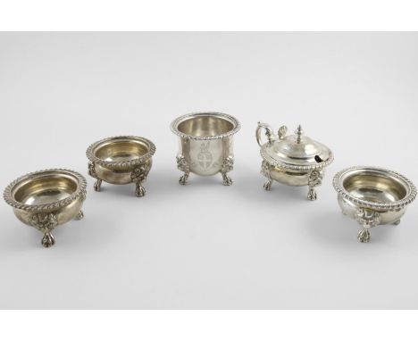 A MATCHED SET OF FIVE GEORGE V LARGE CONDIMENTS. with gadrooned borders and lion-mask and paw feet, the mustard pot and one s