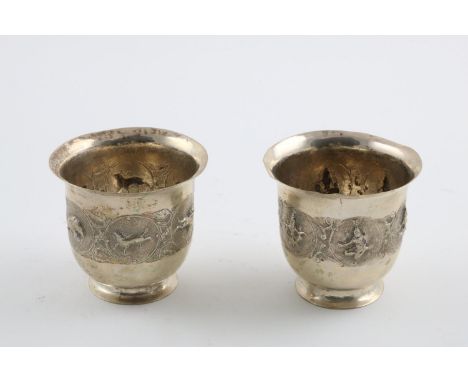 A PAIR OF 19TH/EARLY 20TH CENTURY SIAMESE BEAKERS. with flaring rims, one chased and embossed with floral scrolls and animals