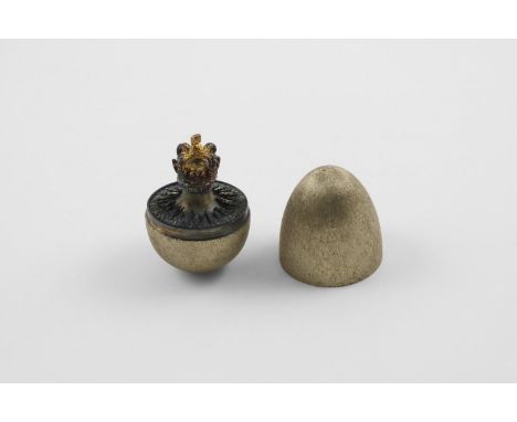 BY STUART DEVLIN:-. a late 20th century silvergilt "surprise" egg, with a textured surface, opening to reveal St Edwards crow