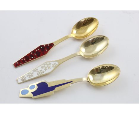 THREE MODERN DANISH SILVERGILT &amp; ENAMEL SPOONS. one "month" spoon decorated with blue enamel and with "JULY 1962" on the 