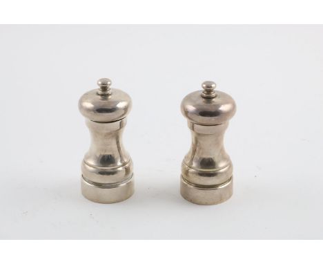 A PAIR OF MODERN PEPPER MILLS. by M C Hersey &amp; Son Ltd, London 1993, (with innards); 4.25" (11cm) high.   **BP: 22.5% (in