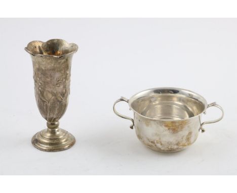 AN EDWARDIAN VASE. with a lobed rim and embossed with repeating  lily of the valley around the body, together with a George V