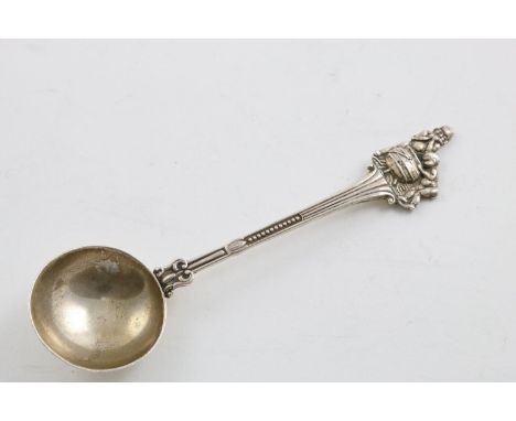 A MID 20TH CENTURY SOUTH AFRICAN TEASPOON. with a deep circular bowl, fluting stem and decorated on the terminal with two nat