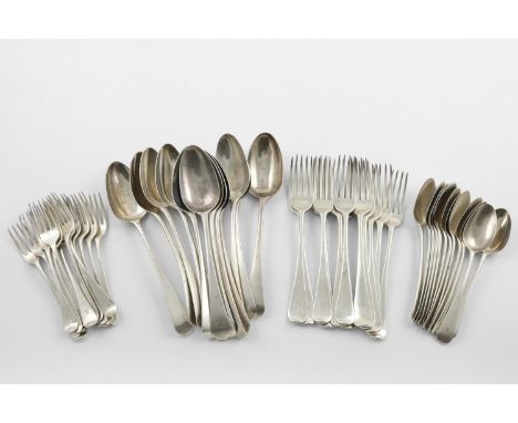 A COLLECTED SERVICE OF OLD ENGLISH FLATWARE:-. 12 tablespoons, 12 table forks, 12 dessert forks and 12 dessert spoons, all in