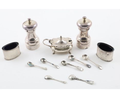 CONDIMENTS:-. a pair of Elizabeth II pepper mills, a George V mustard pot,  pair of George V navette-shaped salts (blue glass