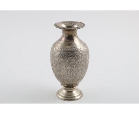A 20TH CENTURY PERSIAN VASE. with an everting rim and profusely chased around the body with birds and flowers; 6.75" (17cm) h