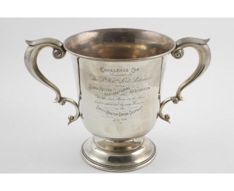 AN EDWARDIAN TWO-HANDLED TROPHY CUP. with scroll handles, inscribed "CHALLENGE CUP Presented by The Rt Honble Lord Poltimore,