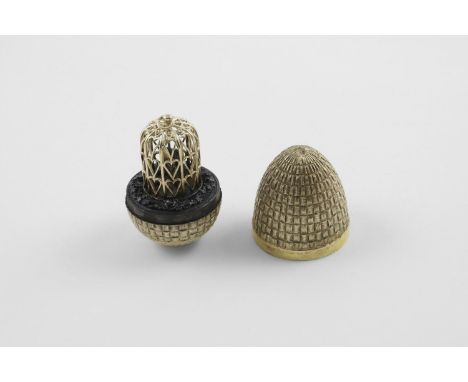BY STUART DEVLIN:-. a late 20th century silvergilt "surprise" egg, with a textured surface, opening to reveal two love birds 