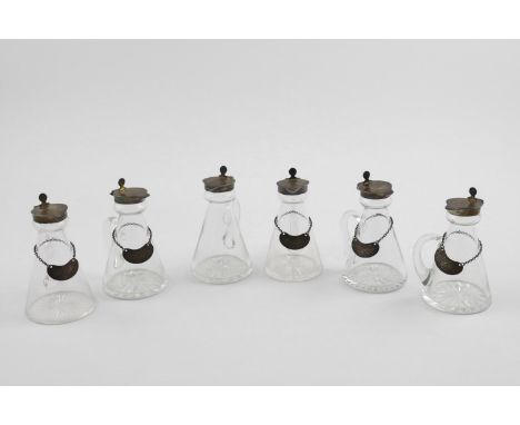 SIX GEORGE V MOUNTED GLASS CHOTA PEGS. a set of four, 1925 with whisky labels, 1923/24/25 and another two chota pegs,  1923/2