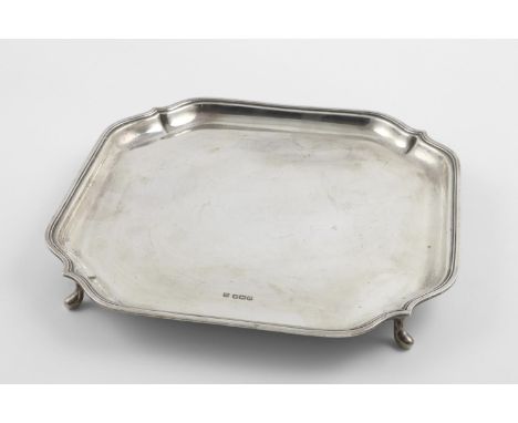 A GEORGE V SALVER. of shaped square outline, with a reeded border and resting on four feet, by Fenton Brothers Ltd, Sheffield