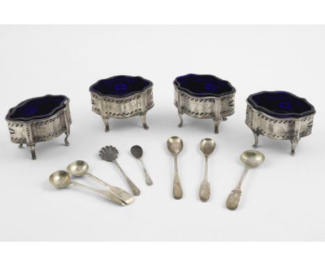 A SET OF FOUR LATE VICTORIAN PIERCED SALTS. of shaped oval outline, with engraved decoration, blue glass liners, by Thomas Br