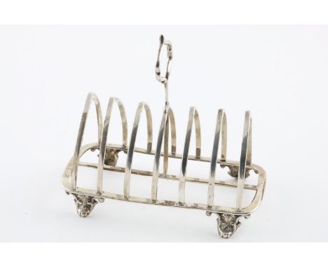 A VICTORIAN TOAST RACK. with seven arched bars and a central handle, by Henry John Lias &amp; James Wakely, London 1880; 7" (