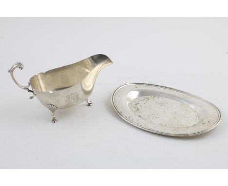 A 20TH CENTURY NORTH AMERICAN SAUCE BOAT. with a wavy rim and a scroll handle, initialled, by Revere Silversmiths of Brooklyn