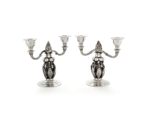 Georg Jensen, a pair of Danish silver Fir Cone twin light candelabra, post 1945 stamped marks, design no. 244, 21cm (8 1/4in)