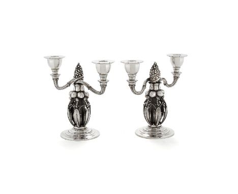 Georg Jensen, a pair of Danish silver Fir Cone twin light candelabra, post 1945 stamped marks, design no. 244, 21cm (8 1/4in)