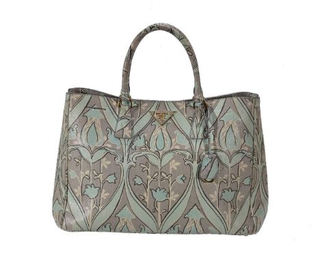 Prada, Anise, a Saffiano leather tote bag, with flower decoration, twin loop handles and gilt metal hardware, a button fasten
