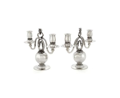 Georg Jensen, a pair of Danish silver Poppy twin light candelabra, post 1945 stamped marks, design no. 324, designed by Georg