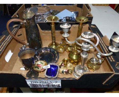 An EPNS water jug and goblet, small tray, two brass effect candle sticks, silver plated candle stick, brass plated plant spra
