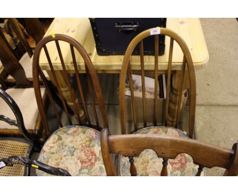 A pair of Ercol stick back chairs 