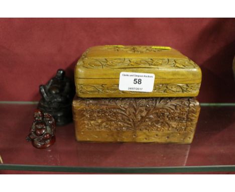 Two carved wooden trinket boxes; together with two Buddha ornaments 