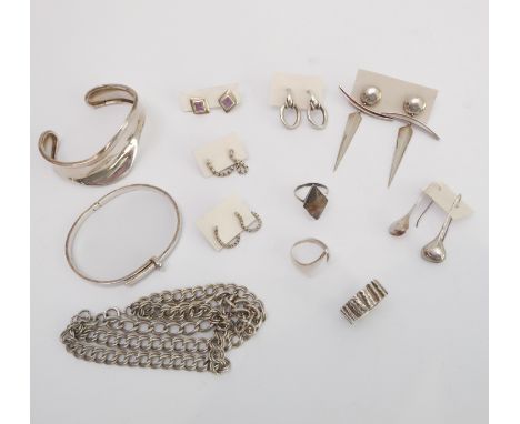 A small group of Modernist silver jewellery - 1960s-80s, including a 'wave' bangle; a heavy bark effect ring, London 1969, si