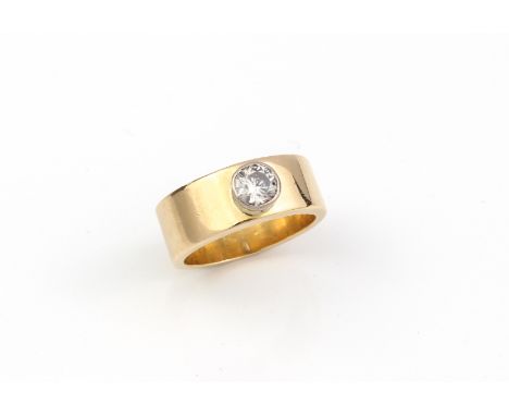 A modernist-style 18ct yellow gold and diamond single stone ring - marked '18CT', the broad band with a single brilliant cut 